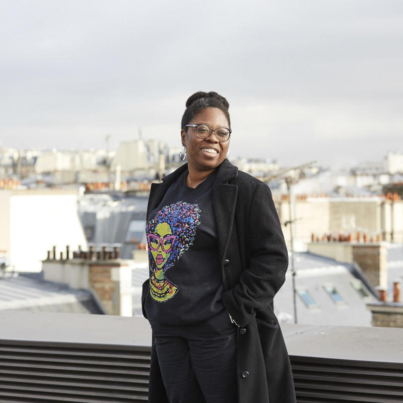 a woman standing on a ledge