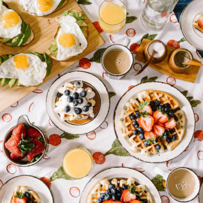 a table with plates of food and drinks