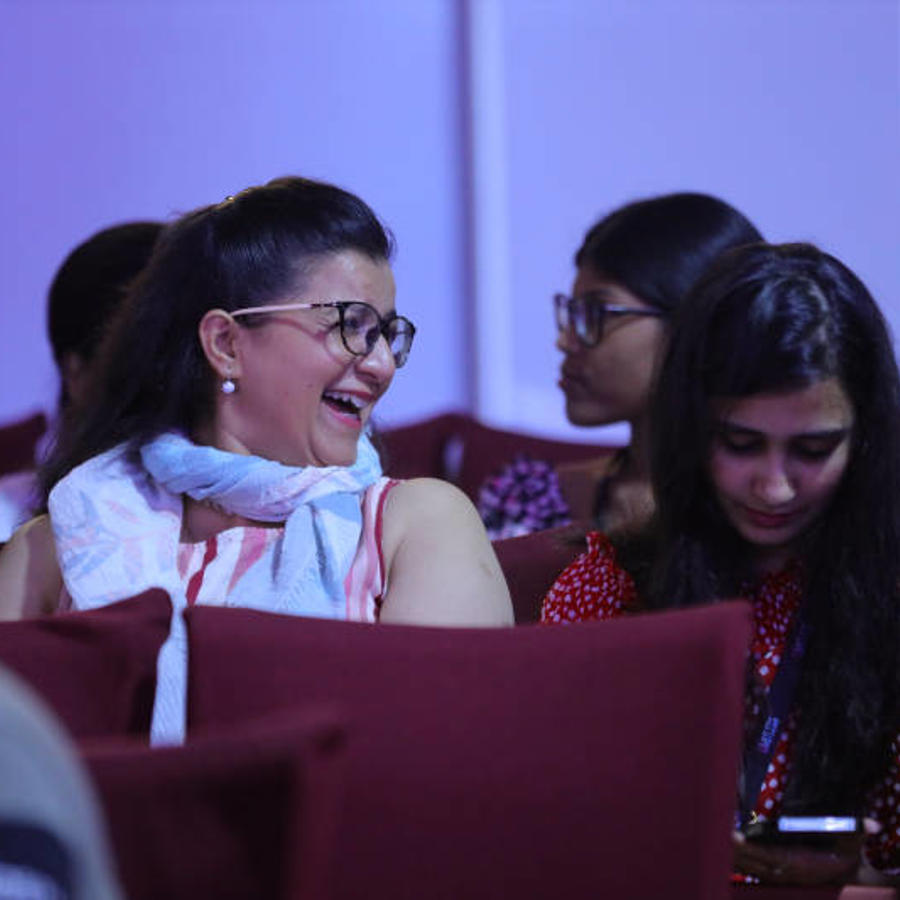 a group of women sitting in a room