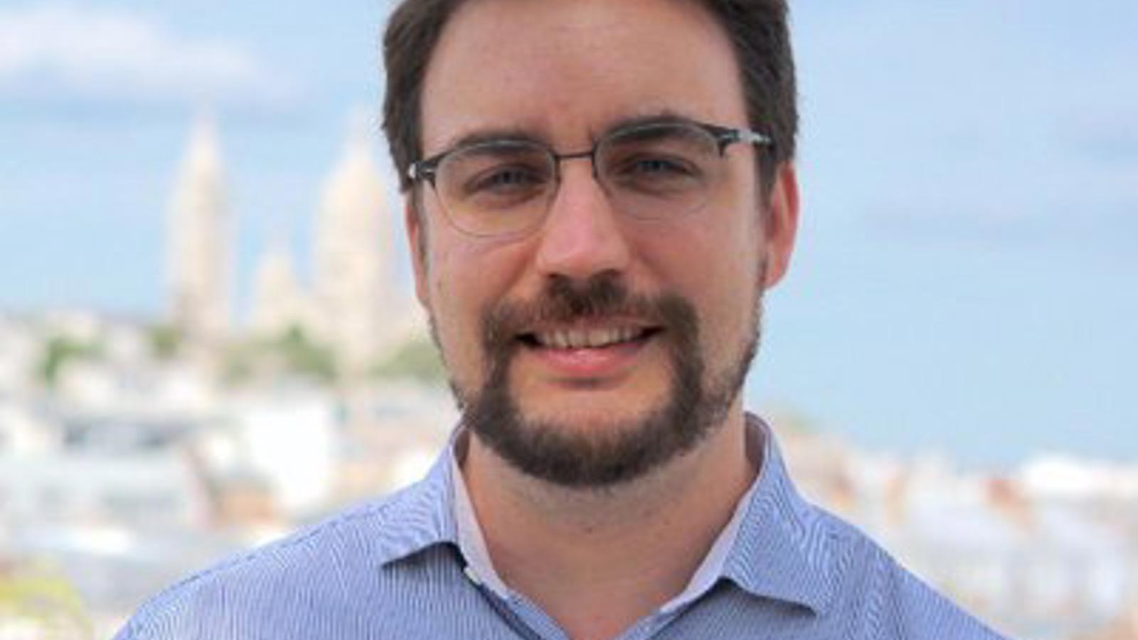 a man with a beard and glasses