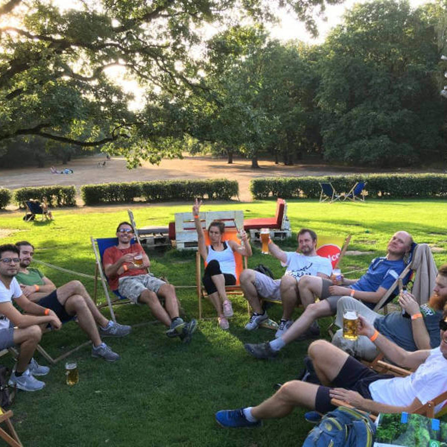 a group of people sitting in chairs outside