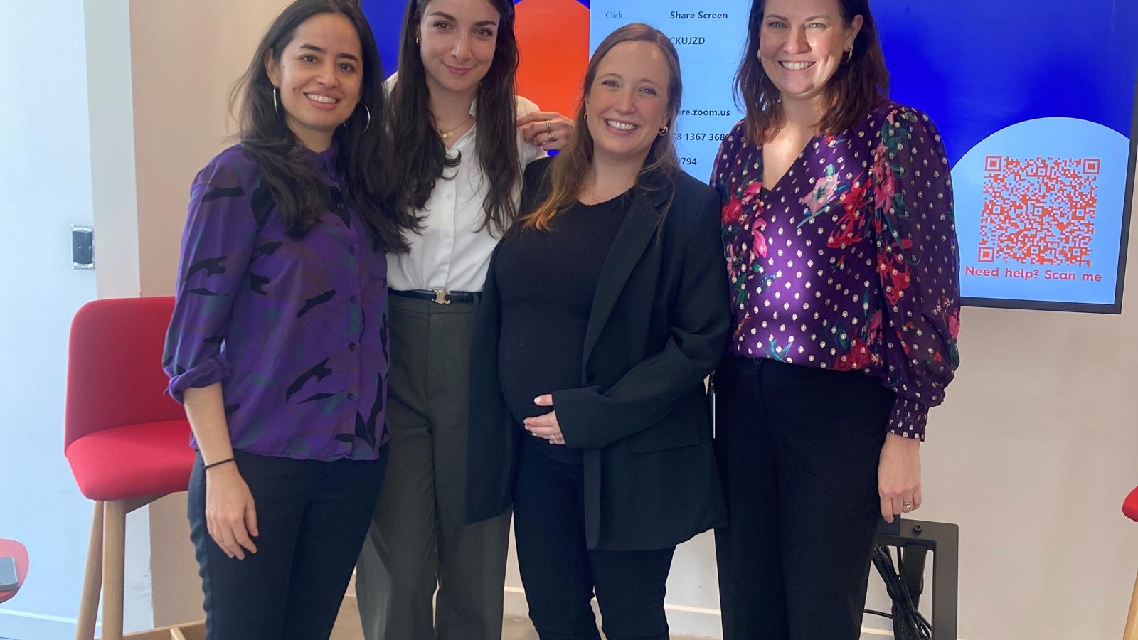 a group of women posing for a photo