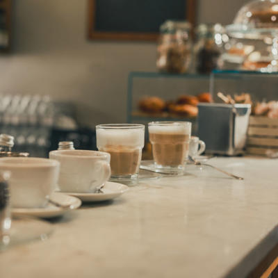 a group of cups and saucers on a counter