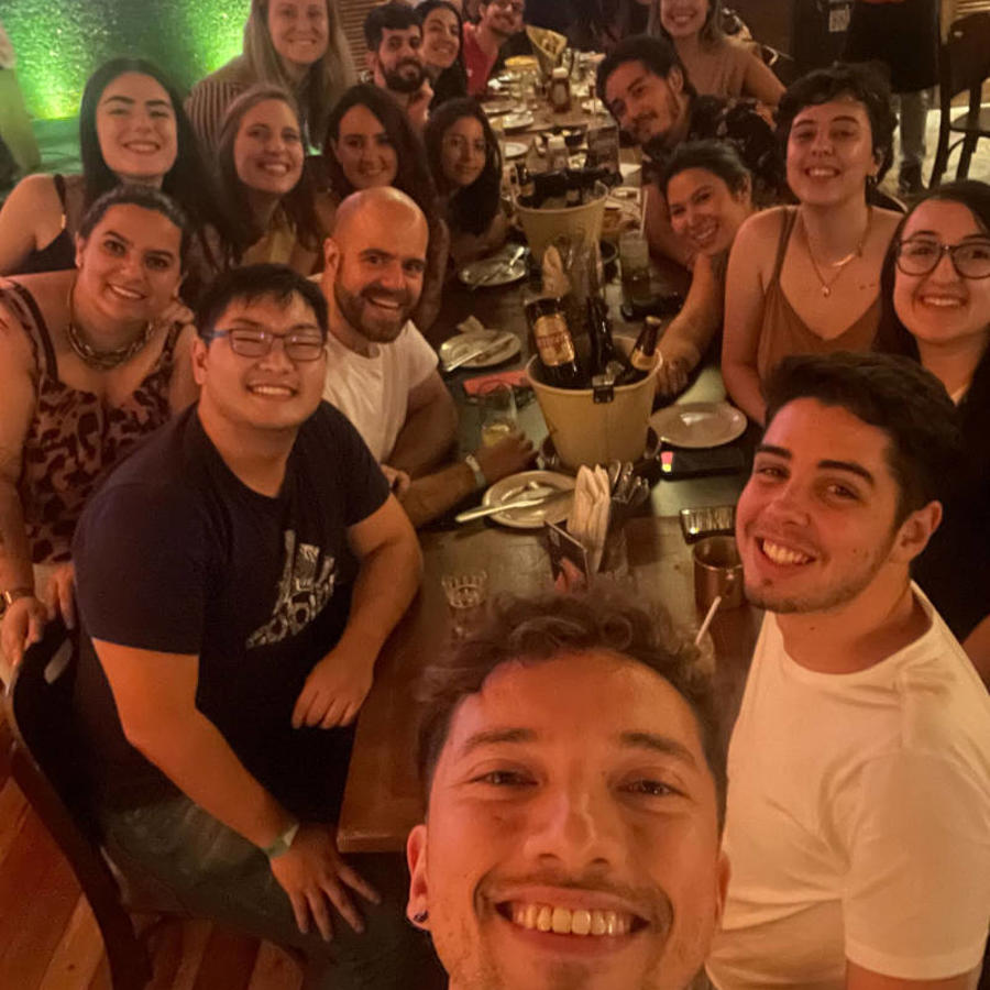 a group of people sitting around a table