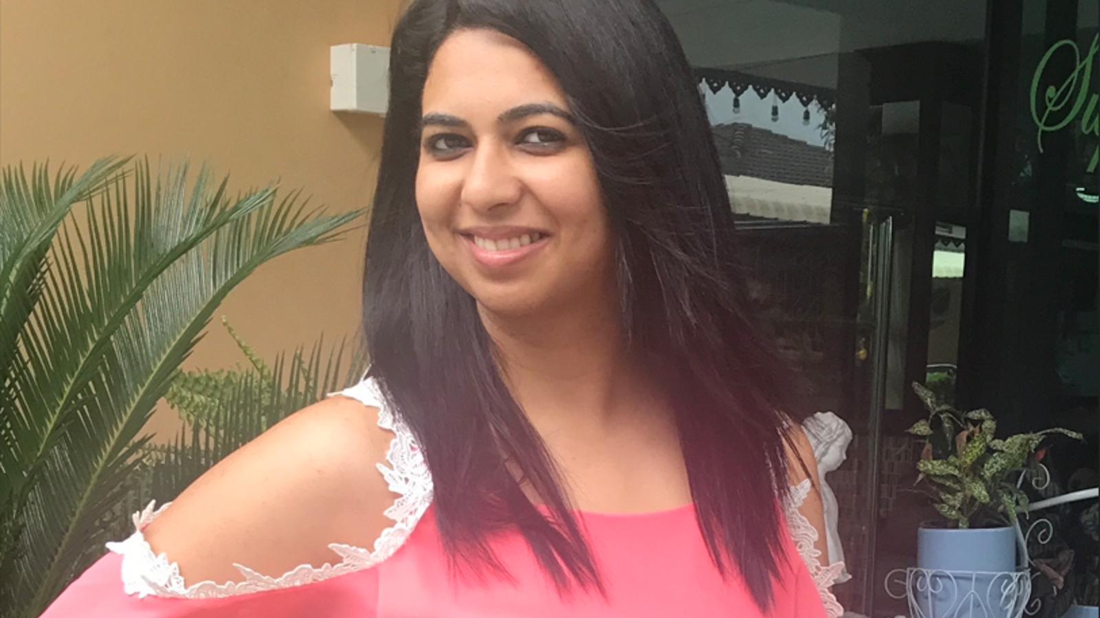 a woman in a pink shirt