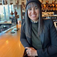 a woman sitting at a bar