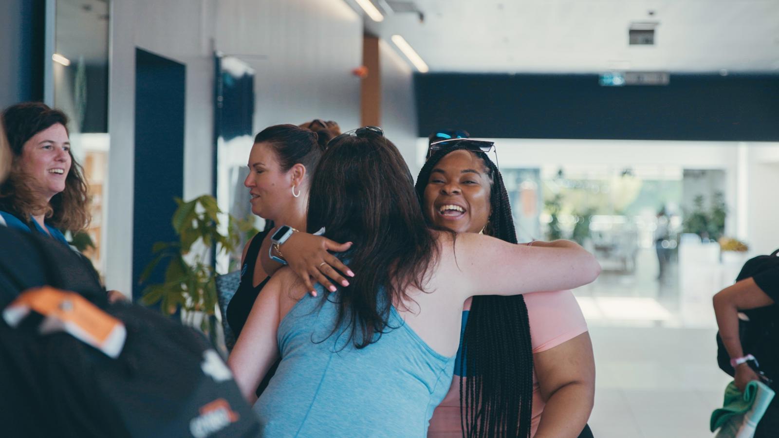 a group of women hugging