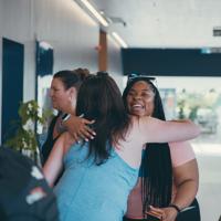a group of women hugging