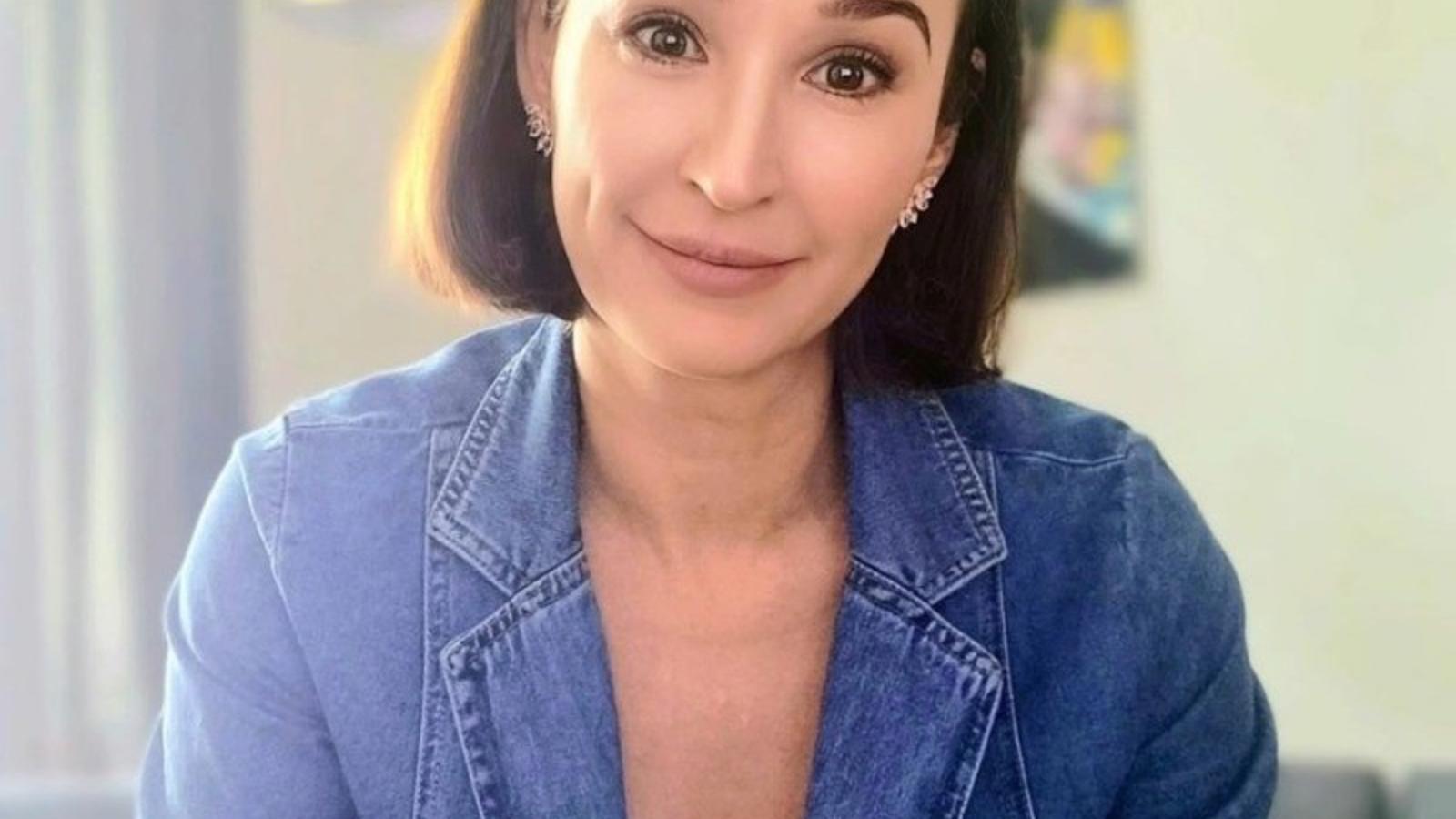 a woman smiling at camera