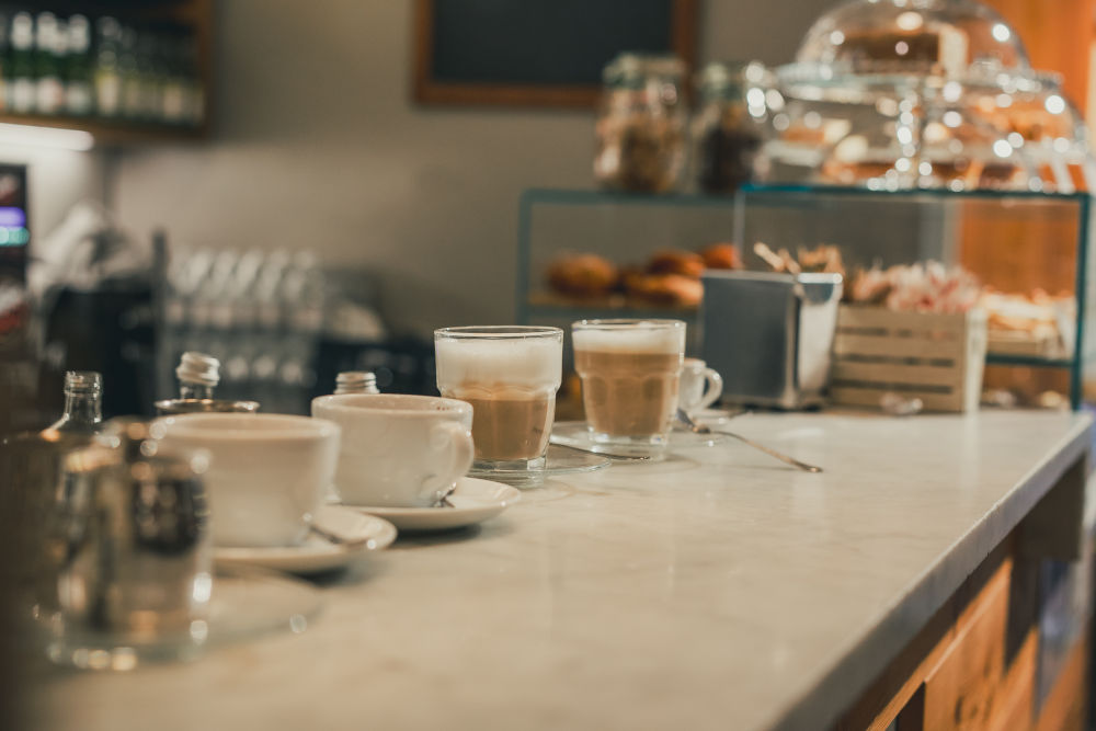 a group of cups and saucers on a counter