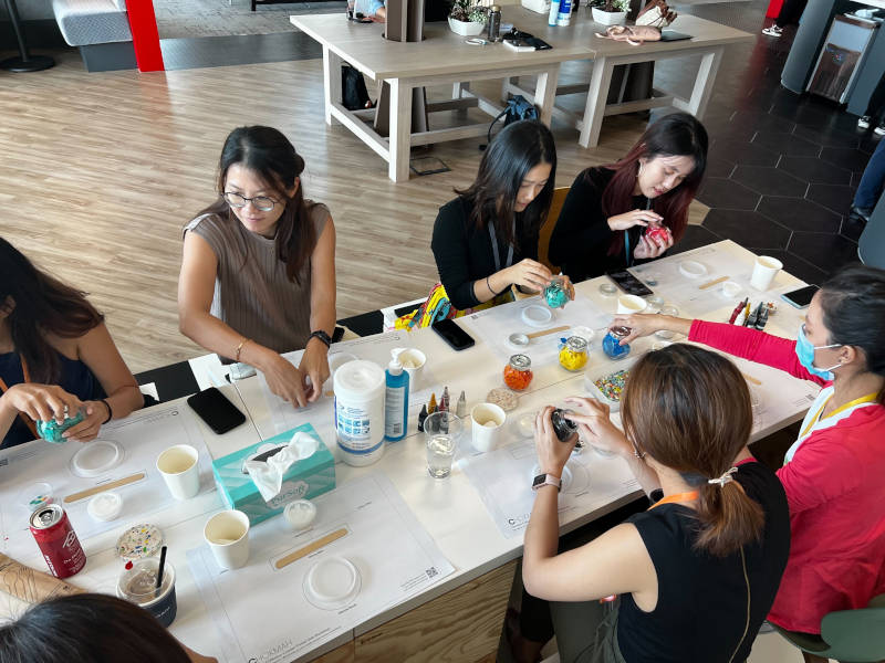 a group of women sitting around a table