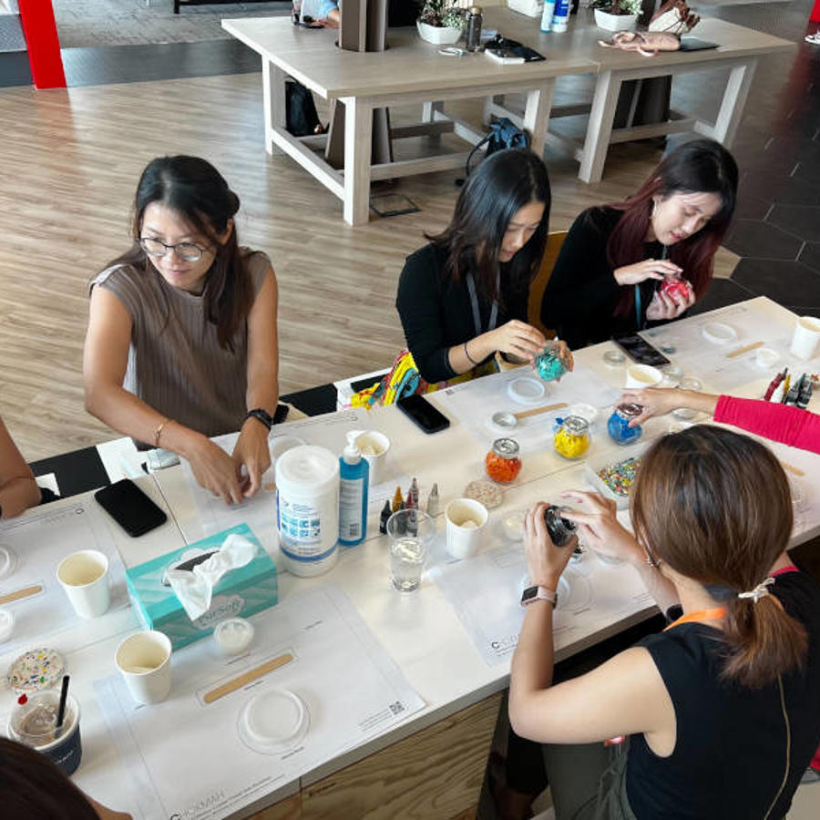 a group of women sitting around a table