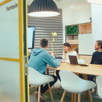 a group of people sitting at a table