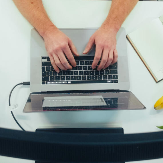 a person typing on a laptop