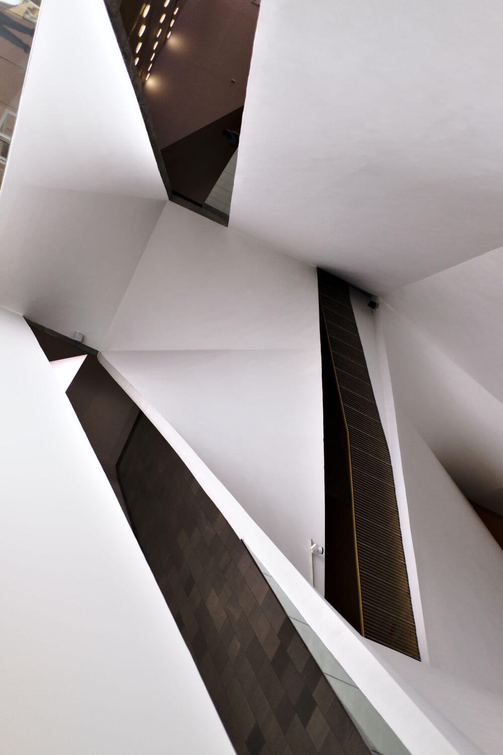 a white and black building with many triangular shapes
