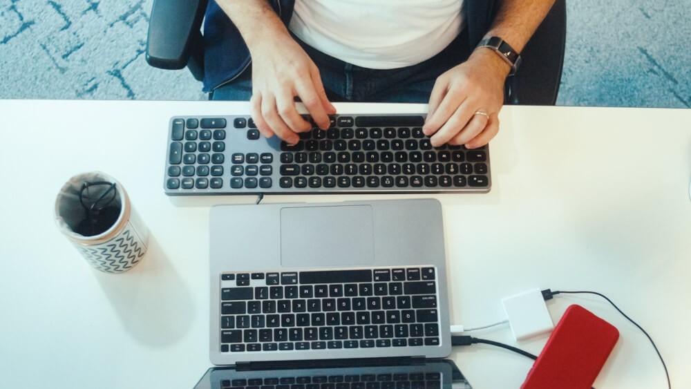 a person typing on a keyboard