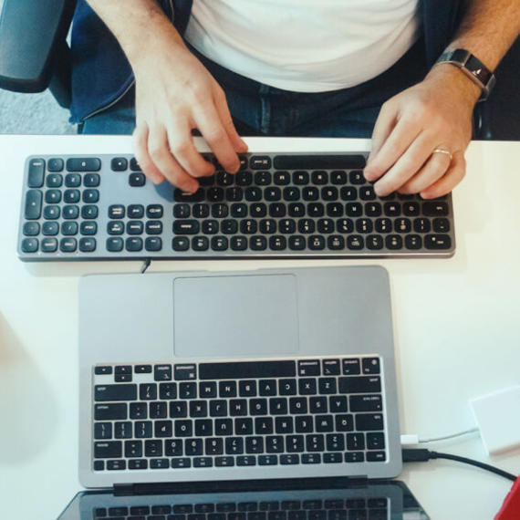 a person typing on a keyboard