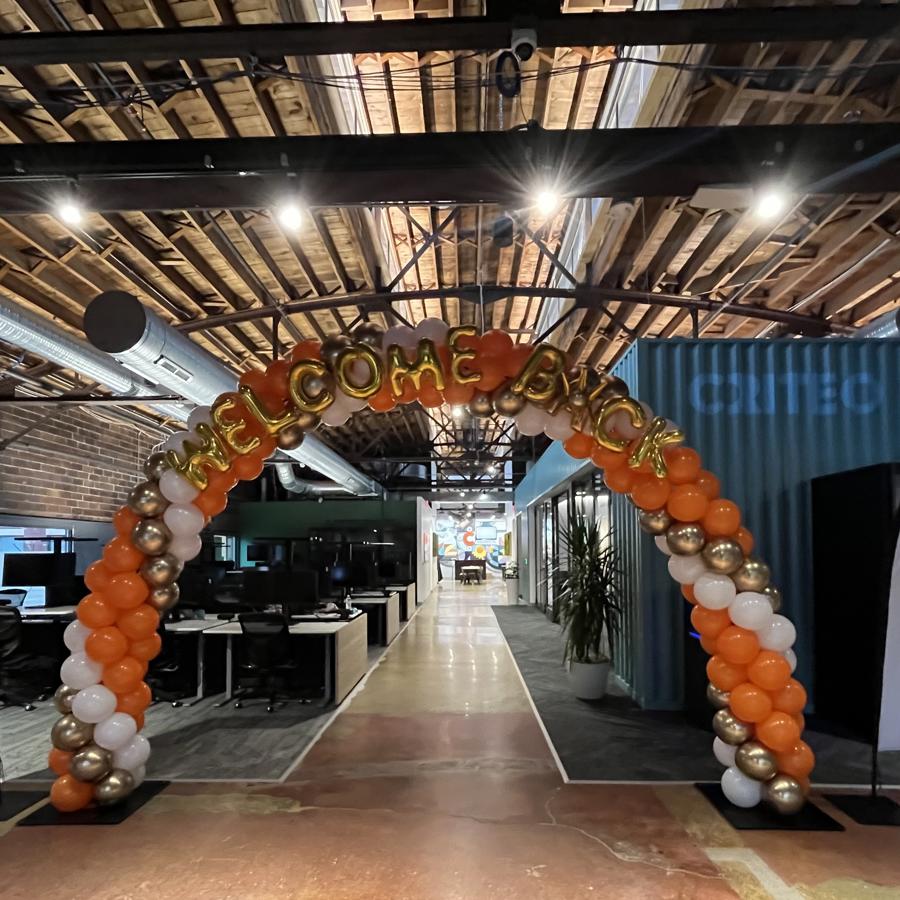 a balloon arch in an office
