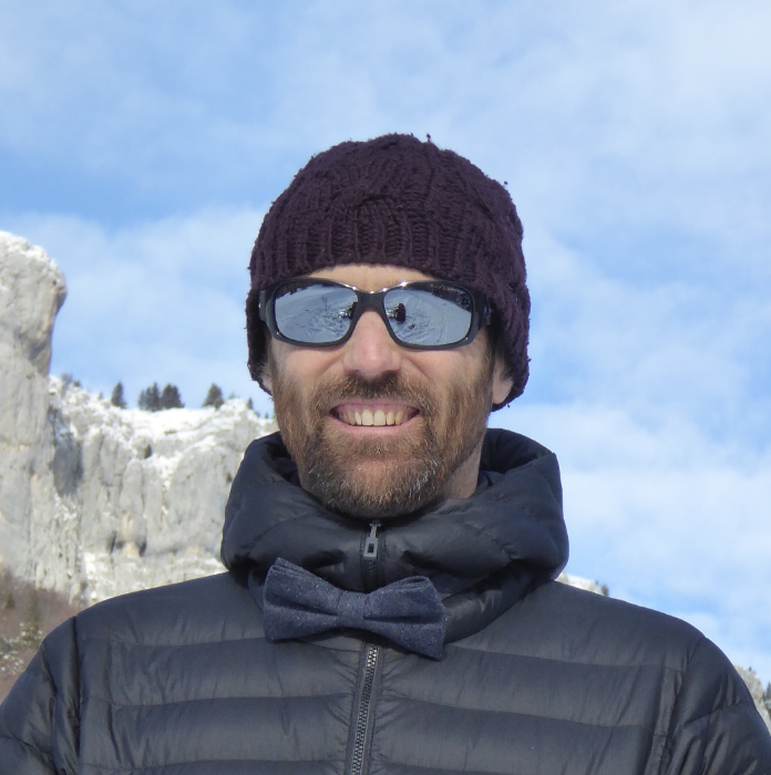 a man wearing sunglasses and a hat