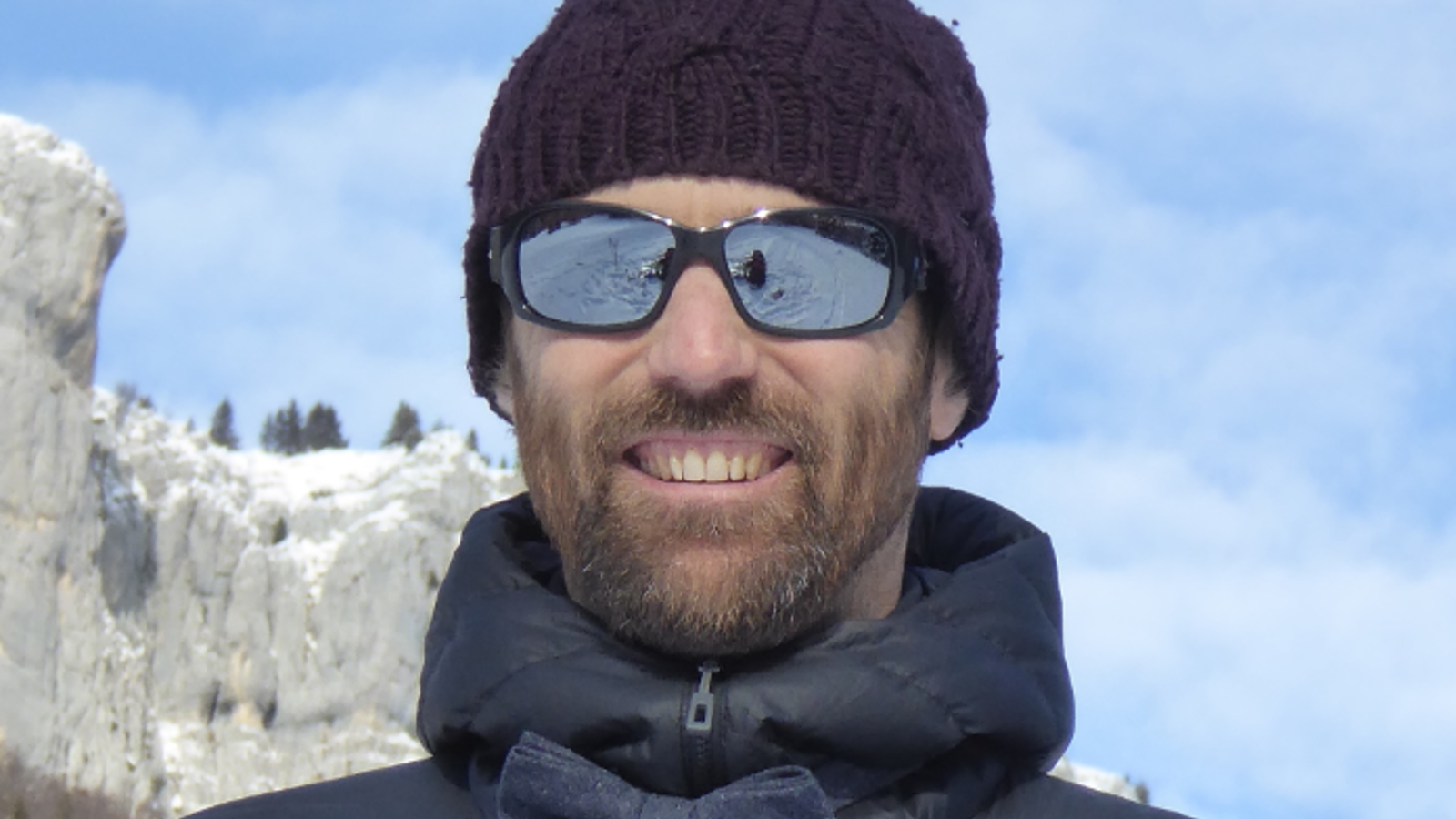 a man wearing sunglasses and a hat