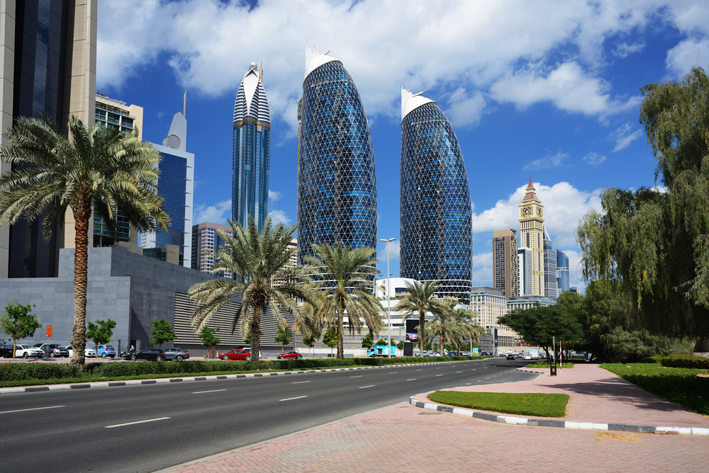 a street with a road and tall buildings