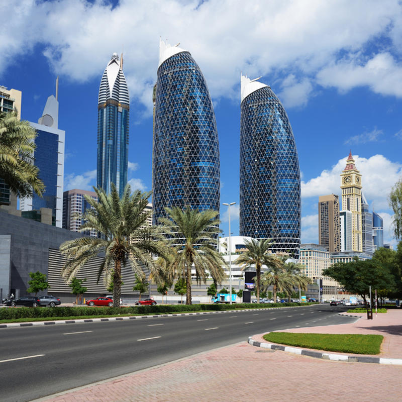 a street with a road and tall buildings
