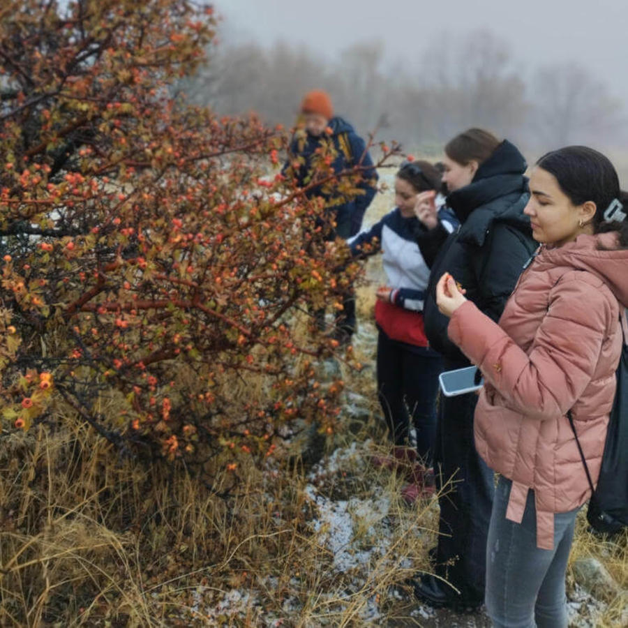 a group of people standing in a field