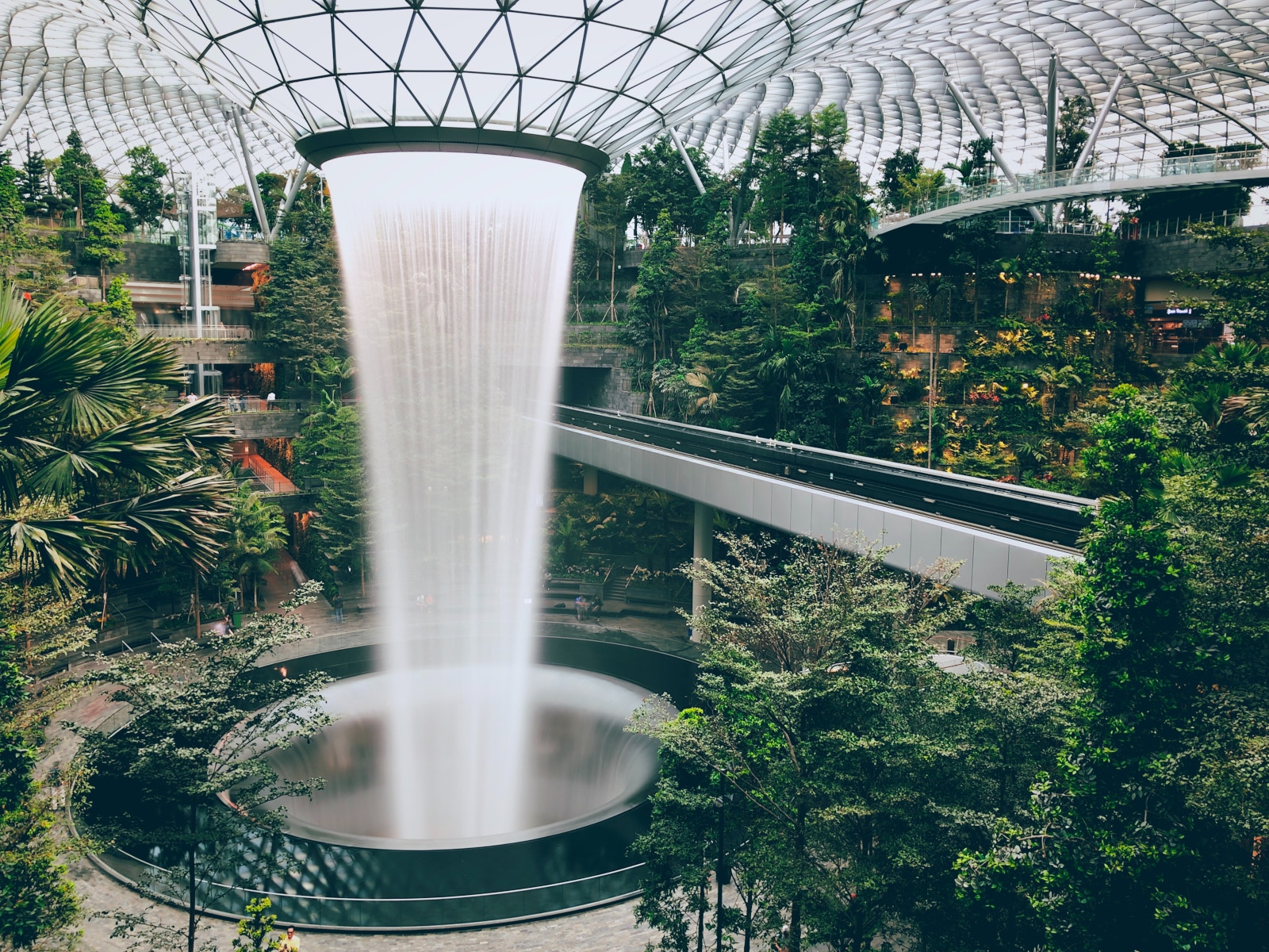 a water fall in a glass dome