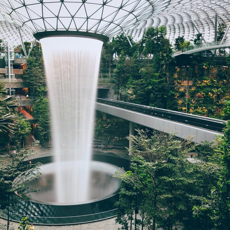 a water fall in a glass dome