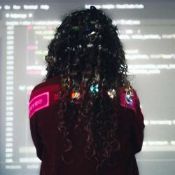 a woman looking at a screen