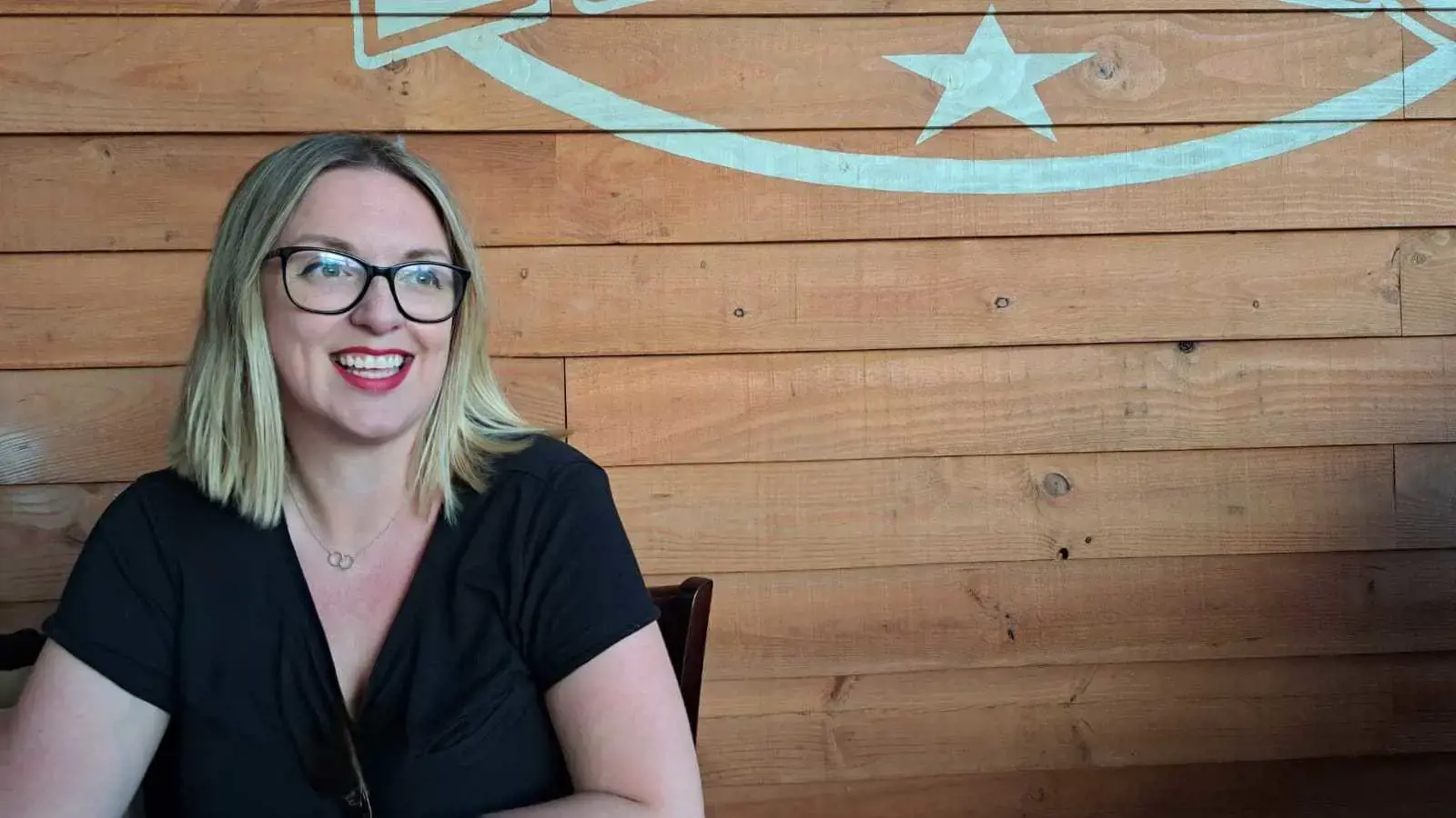 a woman smiling at camera