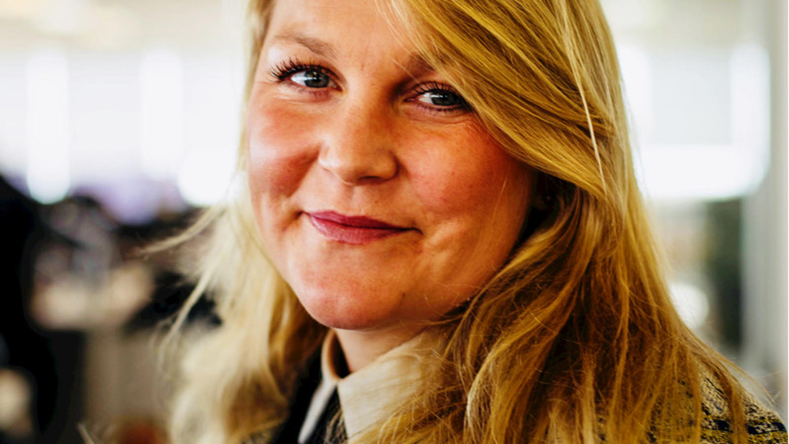 a woman smiling at camera
