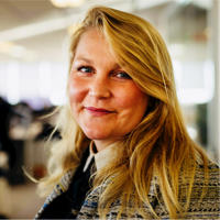 a woman smiling at camera