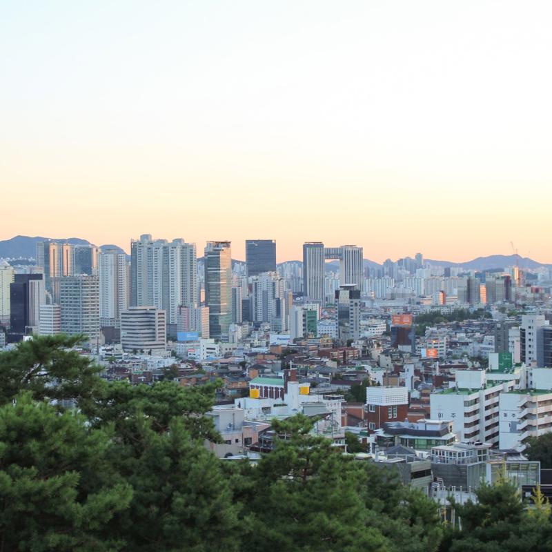 a city with trees in the background