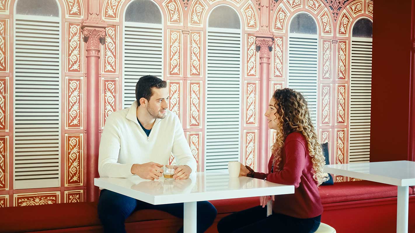 a man and woman sitting at a table