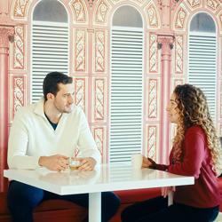 a man and woman sitting at a table