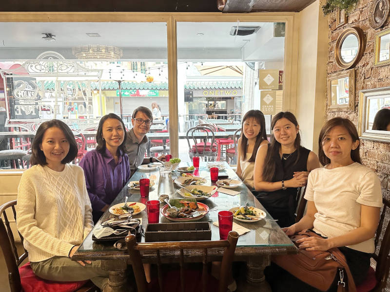 a group of people sitting at a table