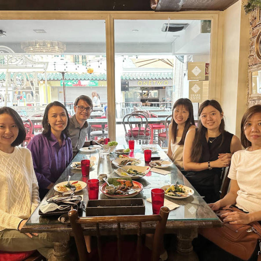 a group of people sitting at a table