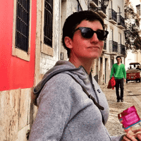 a woman holding a bag of food in a street