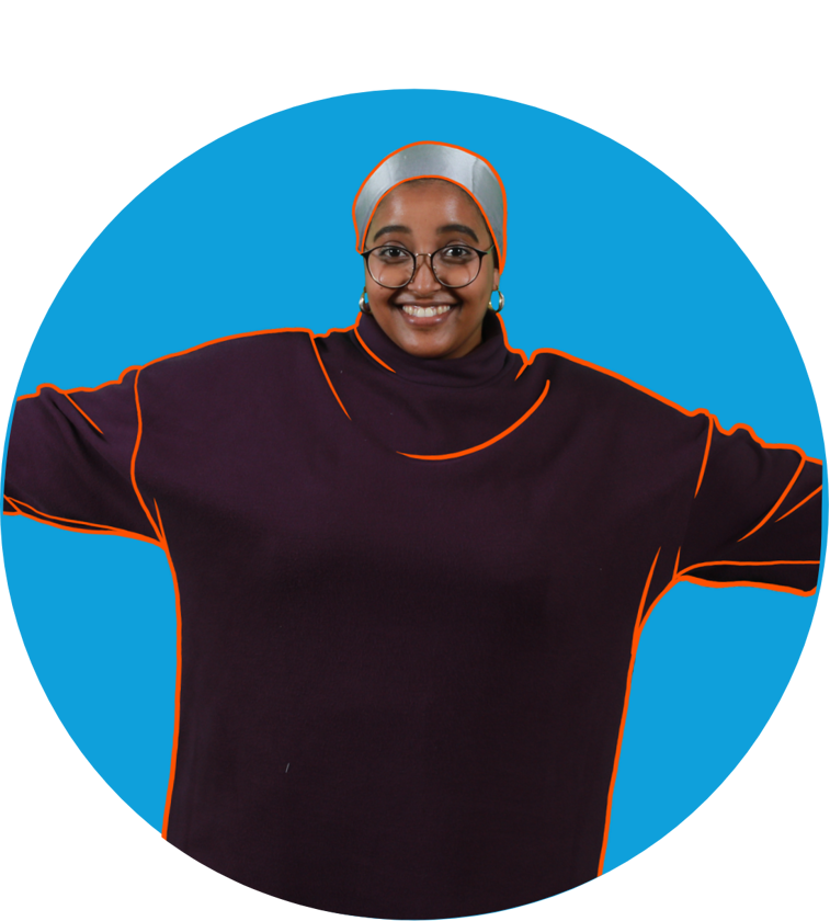 a woman wearing glasses and a purple shirt