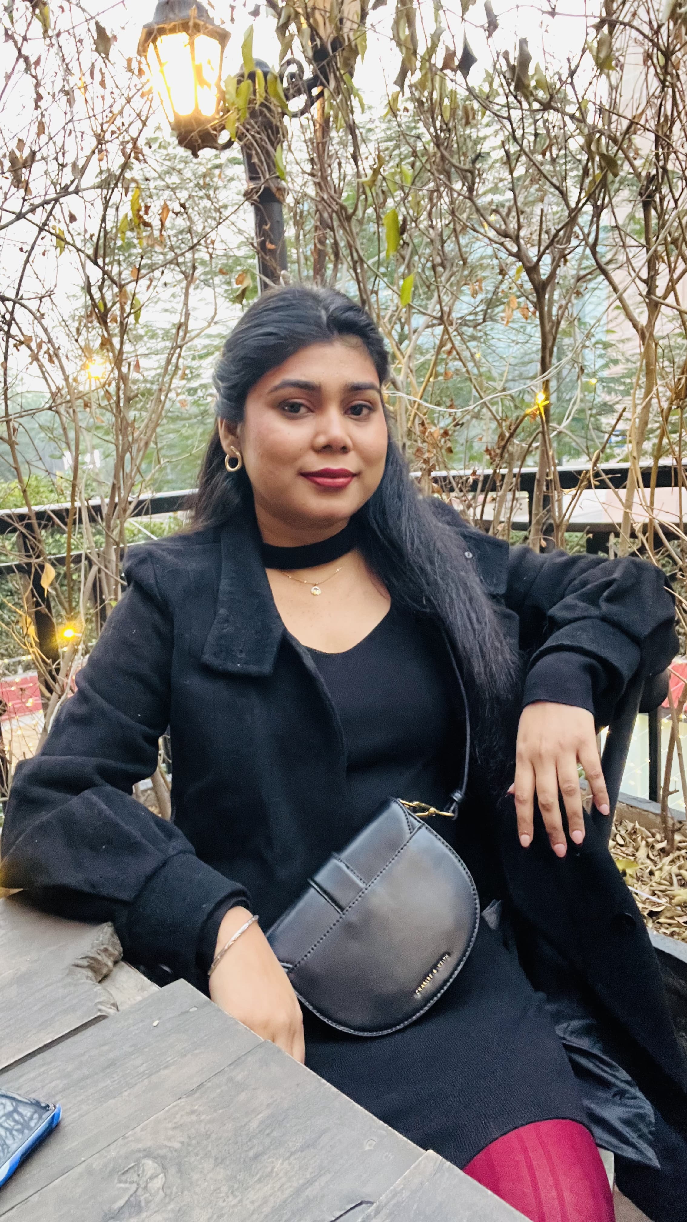 a woman sitting on a bench