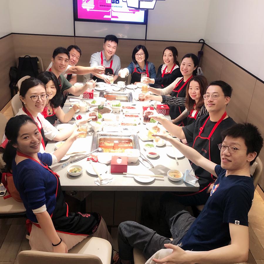 a group of people sitting around a table