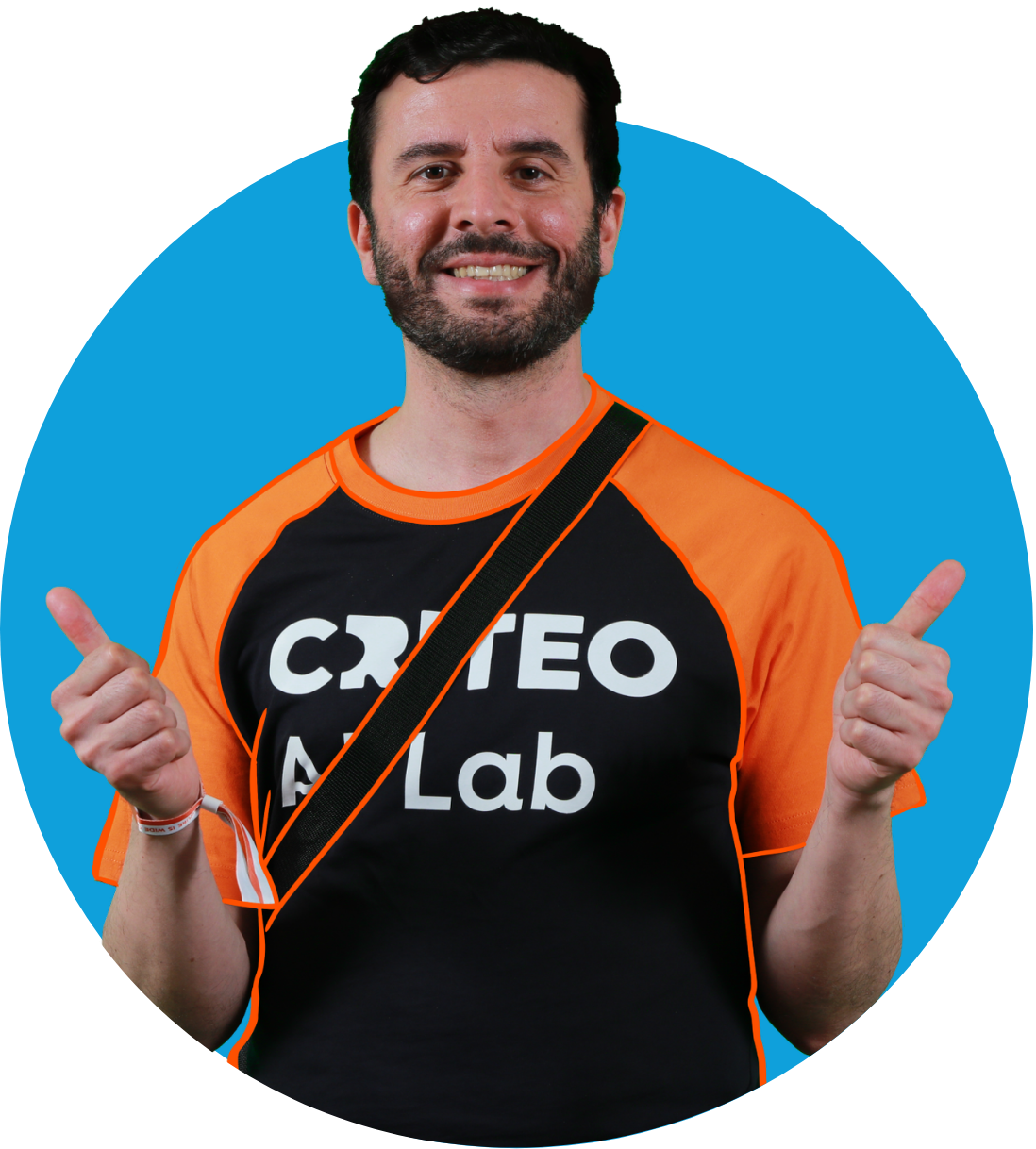 a man with a beard and a black shirt with white text and a blue circle