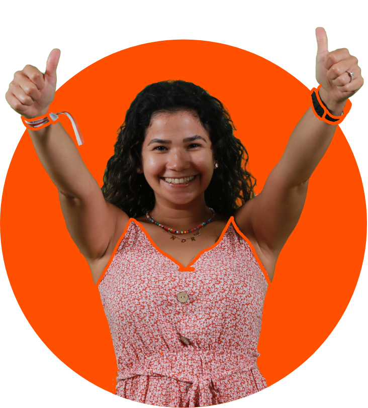 a woman smiling with her thumbs up