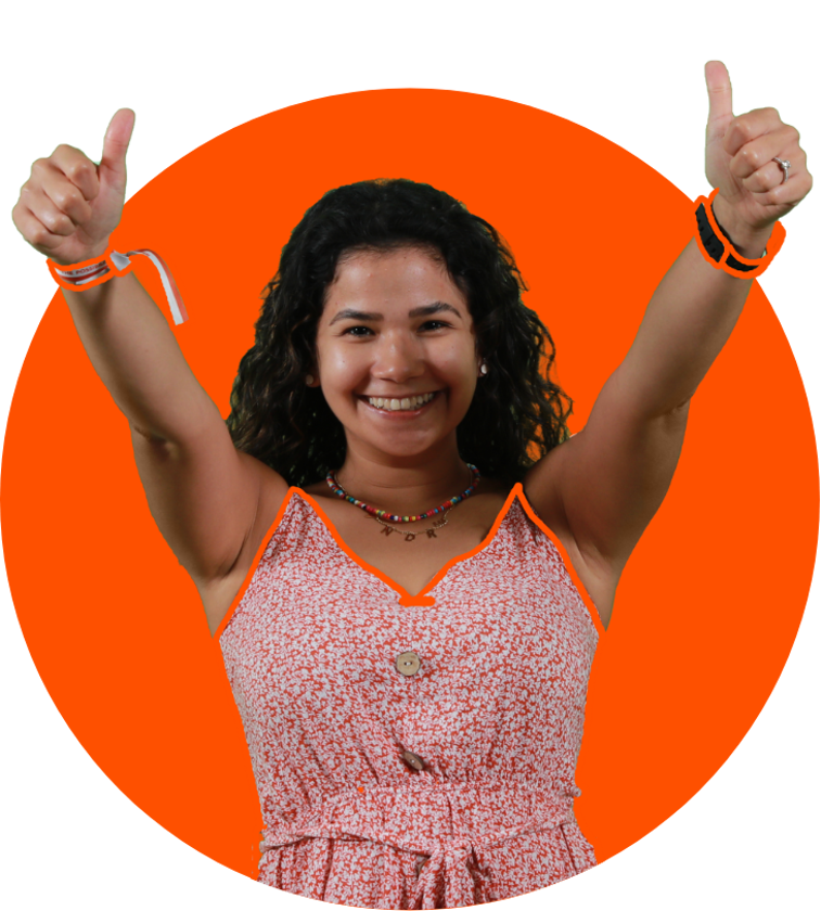 a woman smiling with her thumbs up