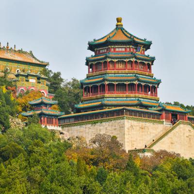 a building with a tower and trees