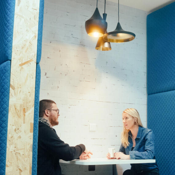 a man and woman sitting at a table