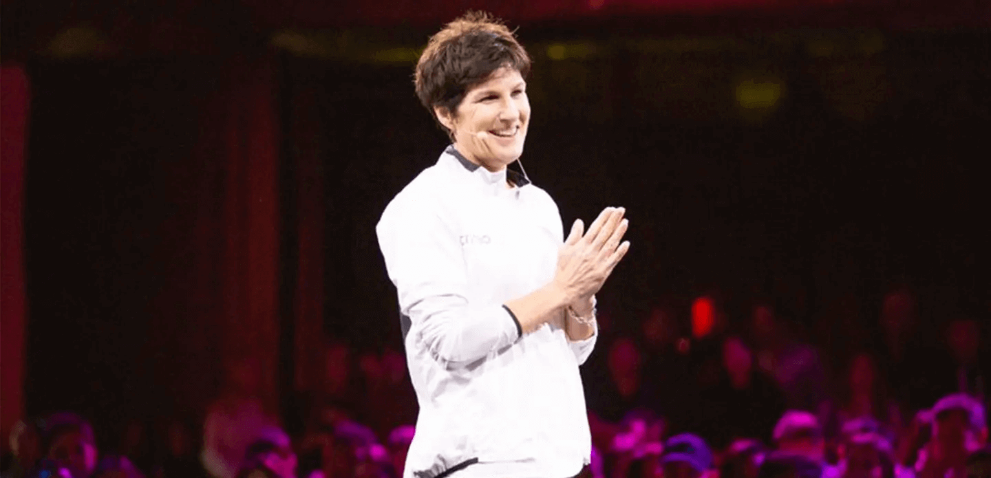 a woman smiling and clapping