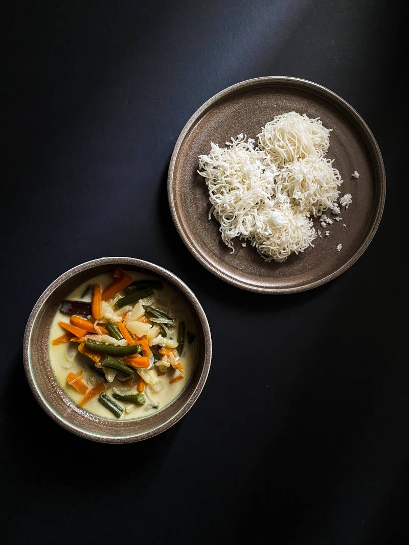 a plate of food on a black surface