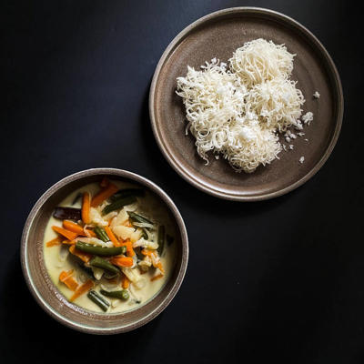 a plate of food on a black surface